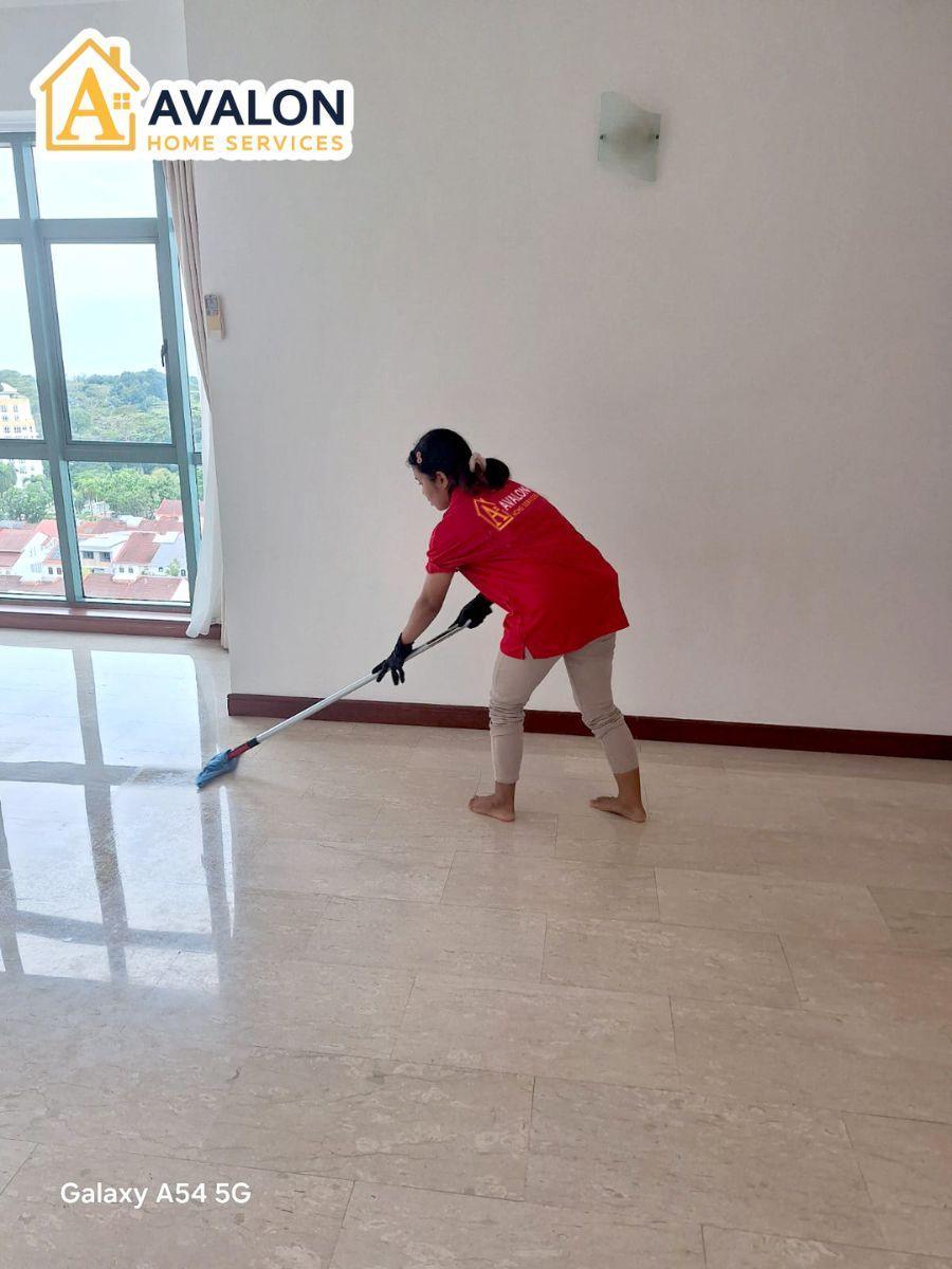part-time helper mops marble floor tile